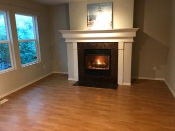 1. Location Location South Family Room 2. Family Room Walls and ceilings appear in good condition overall. Flooring is laminate wood grain material.