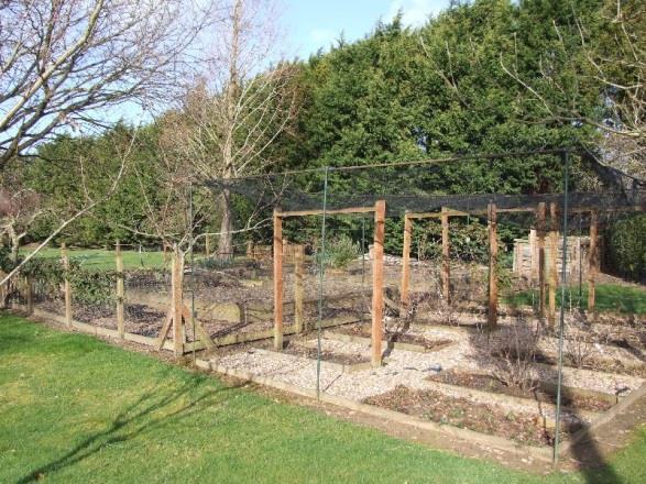 Behind the garage there are two timber garden stores measuring approximately 8 0 x 6 0 (2.44m x 1/83m). An enclosed fowl pen with chicken house and duck house in separate enclosures.