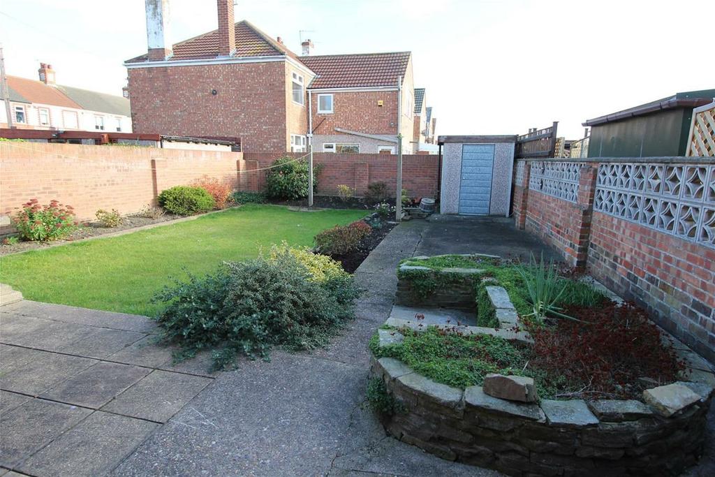 GARDENS The front garden is ornamental with a wide driveway, it is easily maintained, there is hedging, wall,