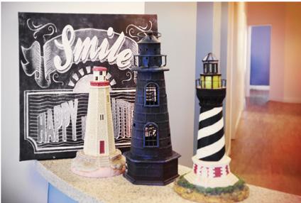 beach cottage motif adorn the space. And the color scheme is a and gray. Everyone seems to love our lighthouse and beach theme.