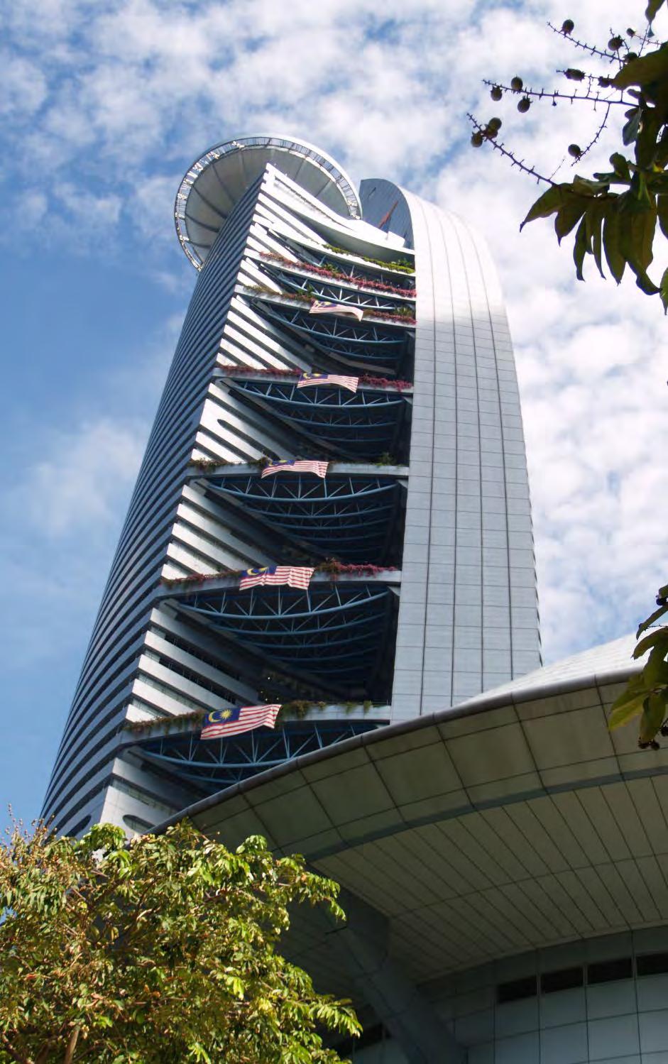 The Menara TM Sky Gardens occur at every three floors on alternate sides of office tower.