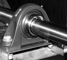 Using a drift pin or centerpunch, tap the collar (in the hole provided) tangentially in the direction of rotation while holding the shaft. Retighten the set screw.