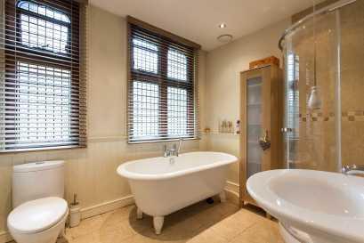 low level wc, panelling to dado height, chrome tubular towel rail/radiator Ceramic tiled floor THE GARDENS The rear garden is a particular feature of the property