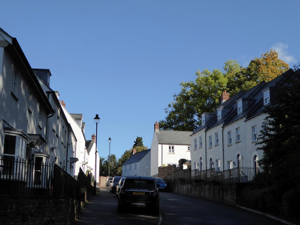 Figure 3: Entering the area set among trees. Views out of the housing area are limited at street level, but many houses enjoy good views over the town centre to the Blorenge.