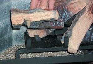 Push the back of the log against the 2 front brackets with the