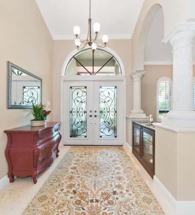 Foyer with Granite Topped Lighted Curio Cabinet In the living room,
