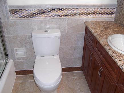 M Residence Bathroom Design Materials Grandeur porcelain 8 1 2 x 17 tile with matching porcelain chair rail and trim.