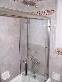 commode, treated glass custom frameless shower doors. Precision and attention to detail was required to create this oasis.