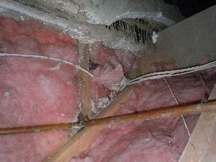 However, sealing the top plates (where the drywall meets the wood frame of the wall) of your walls, especially in the north bedrooms, would reduce the air leakage through these walls into the attic.