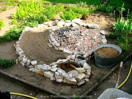 Also, adding gravel and smaller stones as you build your spiral will minimize the quantity of organic material required, add the rubble to the centre where the depth is greatest before adding organic