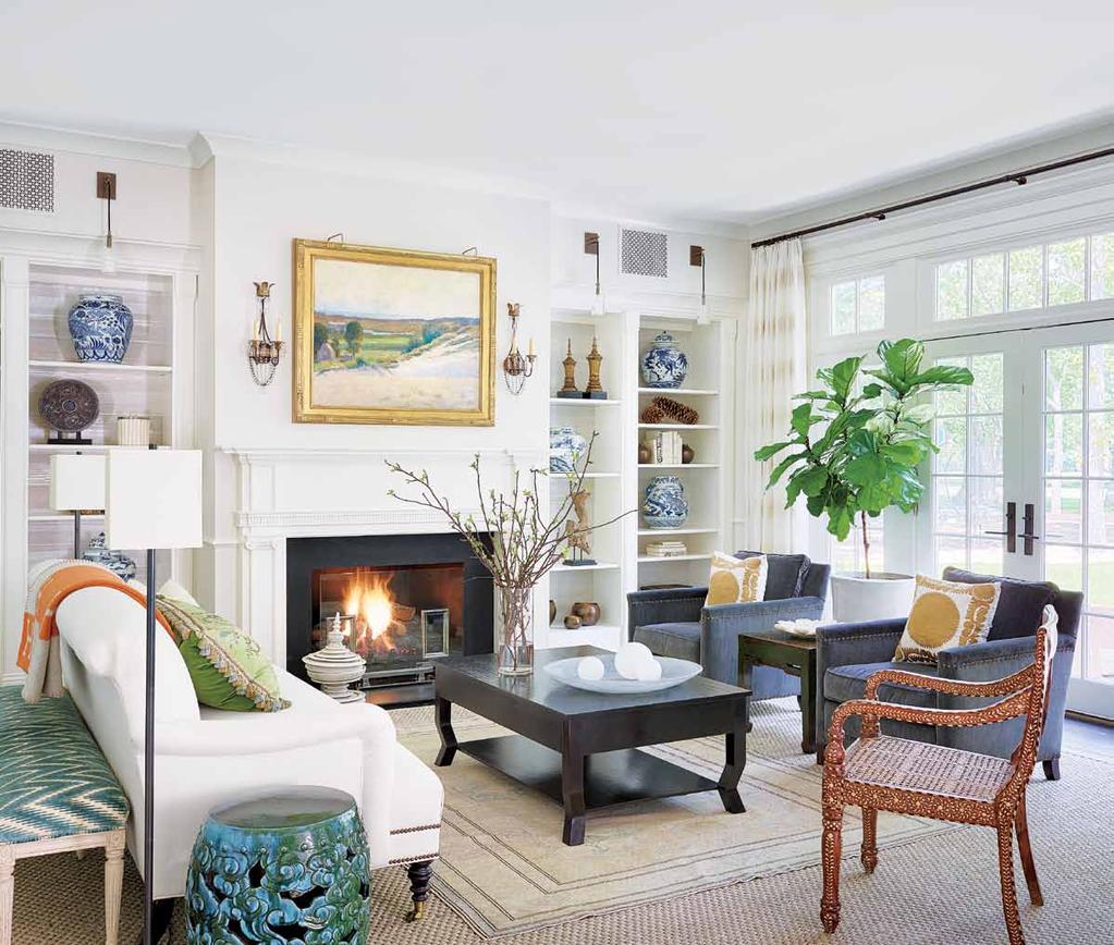 For the living room of this Winnetka home, designer Andrea Goldman placed a custom sofa covered in linen by Rogers & Goffigon and a pair of chairs from Jayson Home around a David Iatesta coffee table