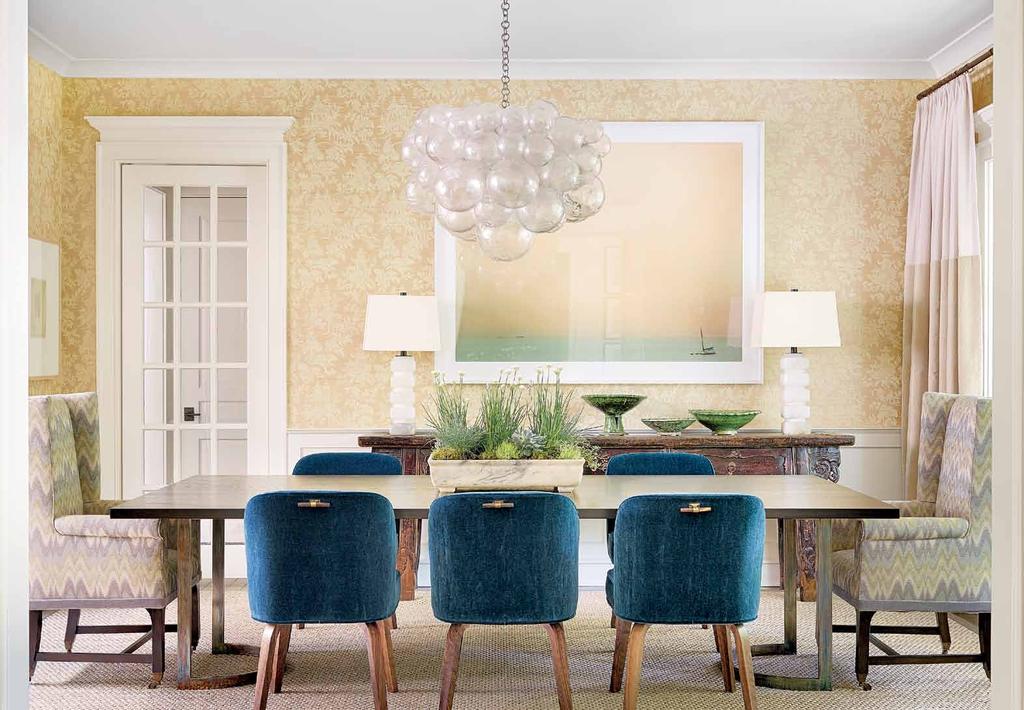 2 4 4 l u x e i n t e r i o r s + d e s i g n Guest chairs by the designer, covered in lush fabric from Cowtan & Tout, adds softness to the dining room s custom table from Aaron