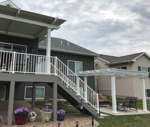 When this homeowner moved into her new house, she started with that basic 10X12 wood deck and soon discovered it was too small, often too hot, too boring and the yearly maintenance too much