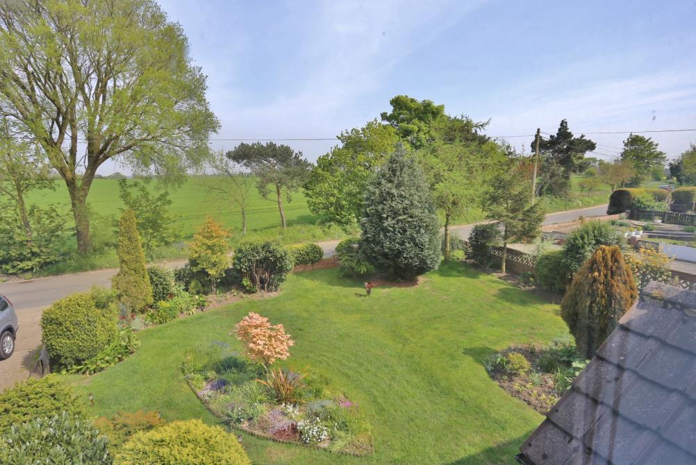 OUTSIDE The property stands on a delightful plot of approximately 1/4 of an acre with all principal rooms and bedrooms offering uninterrupted views over open countryside.