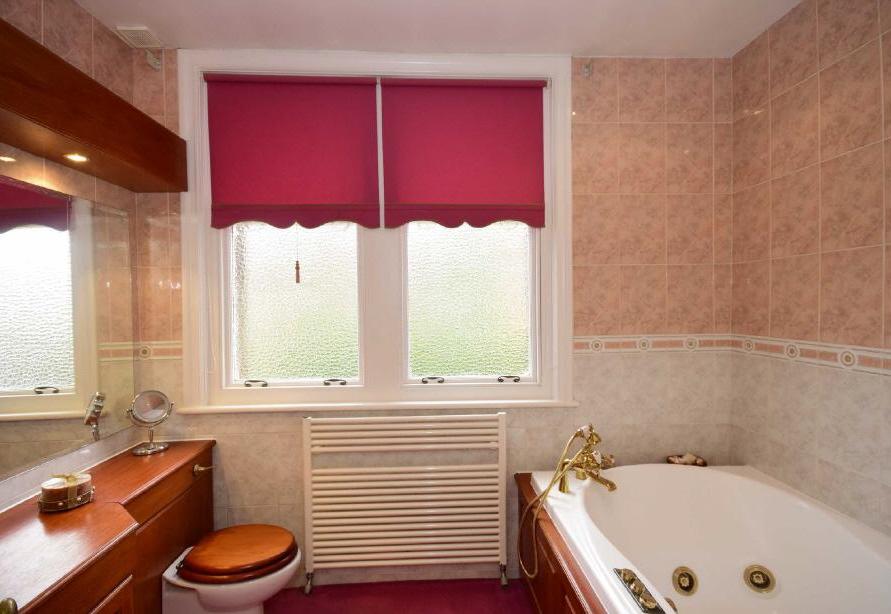 windows to front elevation, fitted mirror with down lighting. Electric shaving point ceiling mounted extractor unit and halogen down lights. Shower Room 6'8" X 9'6" (2.03m X 2.