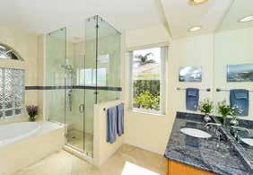 shower: - Travetine tile floor, - Tile walls - 2 toiletry shelves - Rain shower