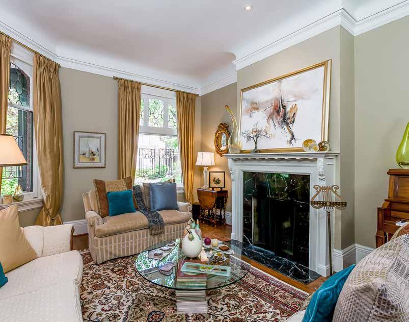 Tall ceilings and period details such as cornice mouldings, ceiling medallions, leaded glass windows, tall baseboards and antique fireplaces showcase the architectural integrity of the home, while