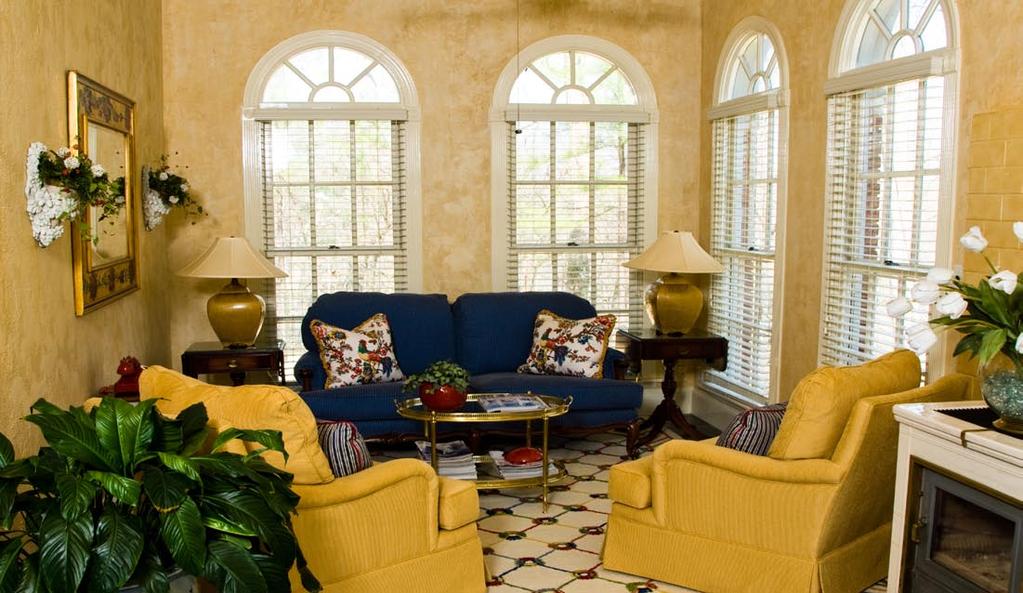 Sunroom: Adjacent to the breakfast area with 4 cathedral windows, this lovely room looks serenely over
