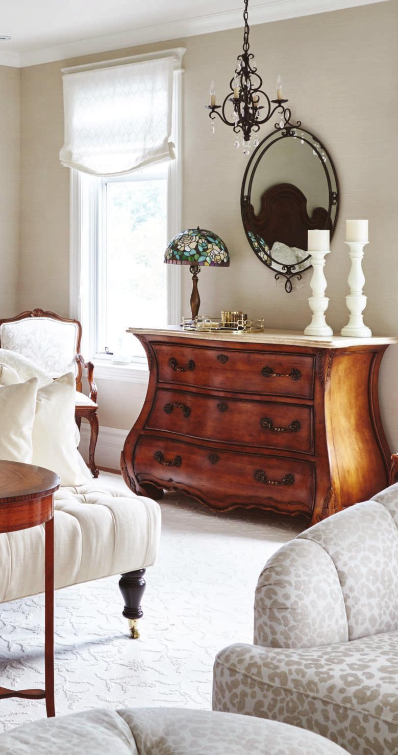 To tone down the heaviness of the client s existing bedroom furniture, delicate new s were added in the master bedroom. The soft palette doesn t compete with the beautiful dark wood in the room.