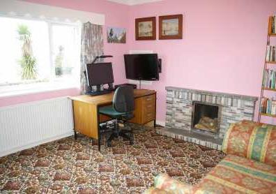 51m (12'11" x 11'6") (Possible reception room) Tiled fireplace with open grate,