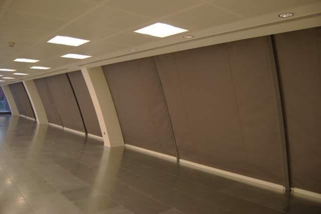 conceal the barriers in the ceiling whilst still allowing access for service
