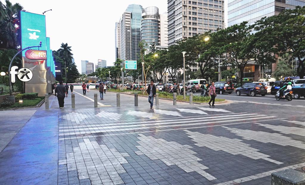 Jenderal Sudirman, Central Jakarta, one of the City s main thoroughfares and a primary access road to the main Asian Games Venue, a new pedestrian corridor has been created by reallocating space for