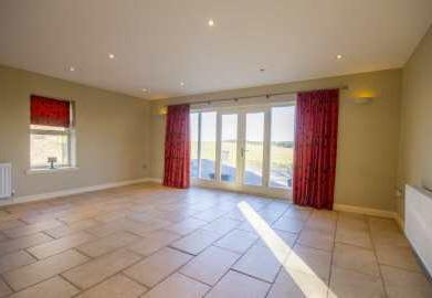 countryside and sea. The spacious interior would make a fabulous family home, which has the benefits of double glazing, oil fired central heating and excellent storage throughout.