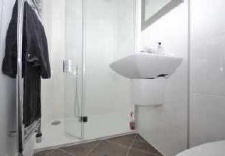 17m) Being a three piece white suite comprising double sized walk in shower cubicle