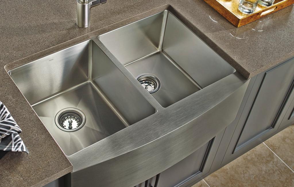 Apron-Front Stainless Steel Sinks Distinguished by an exposed front that drops down to the lower cabinet, rather than stopping at the countertop edge,