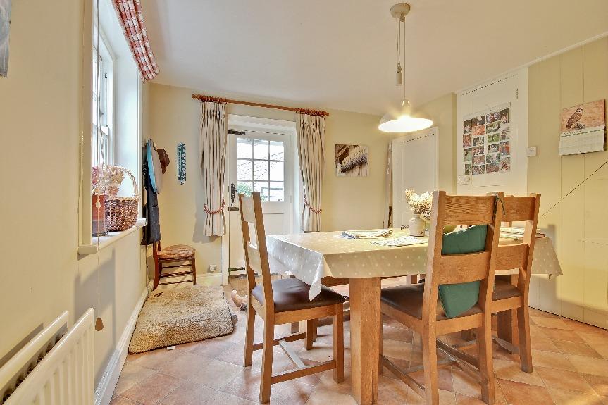 The Property An attractive wooden porch over the front door leads to the welcoming entrance hall, off which are doors to the drawing room, sitting room and dining room.