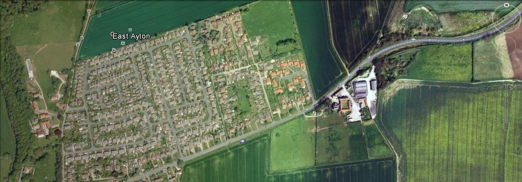 GOOGLE EARTH AERIAL VIEW OF THE SITE The principle of the scheme rests around being accessible and open with houses focusing where possible on the central green, with trees, landscaping and the pond