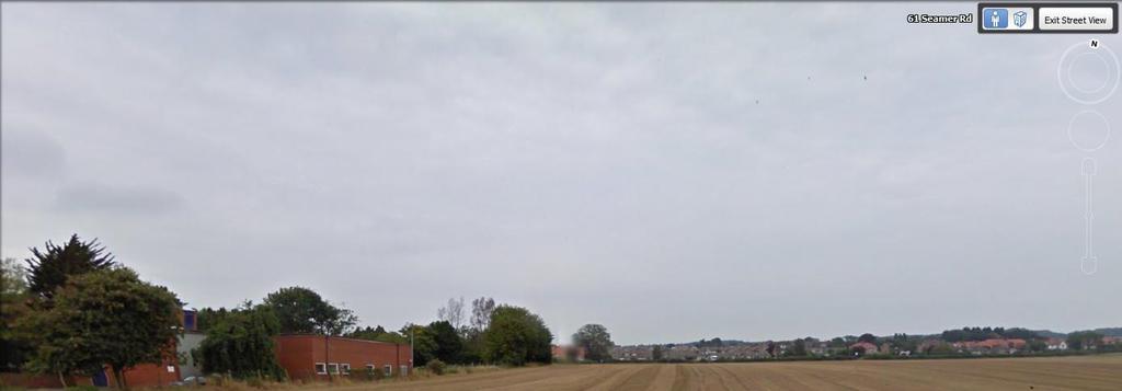 VIEW FROM SEAMER ROAD FACING NORTH WITH RACECOURSE ROAD IN THE FAR DISTANCE LANDSCAPE :- The application site is currently in use as farmed arable land and occupies a small corner of a large open