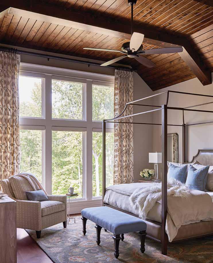 Above: A stained ceiling and large beams add drama to the master suite. The custom bed is crafted with metal, leather, and wood.