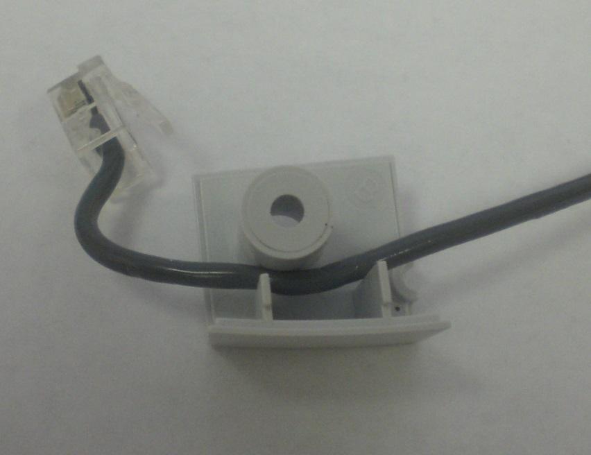 6) Connect the cable connector into the socket (b) - proper insertion should result in a slight click. Gently pull on the cable to ensure proper insertion of connector into the socket.