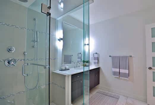 Ensuite Heated porcelain tile floor Five panel glass door Custom cabinetry with quartz countertop Contemporary undermount sink
