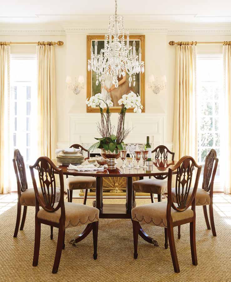 Above: The Gastons reused or repurposed most of their furniture and accessories from their previous home, including their Henkel Harris reproduction inlaid dining room table and Hepplewhite antique
