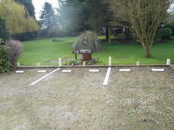 Car Parking bays, one bay for each Garden Room The main entrance into the drive