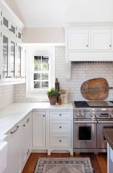 The recently remodeled white-on-white kitchen includes naturally honed white quartzite countertops that give it a clean, modern look. well, and it has weathered beautifully.