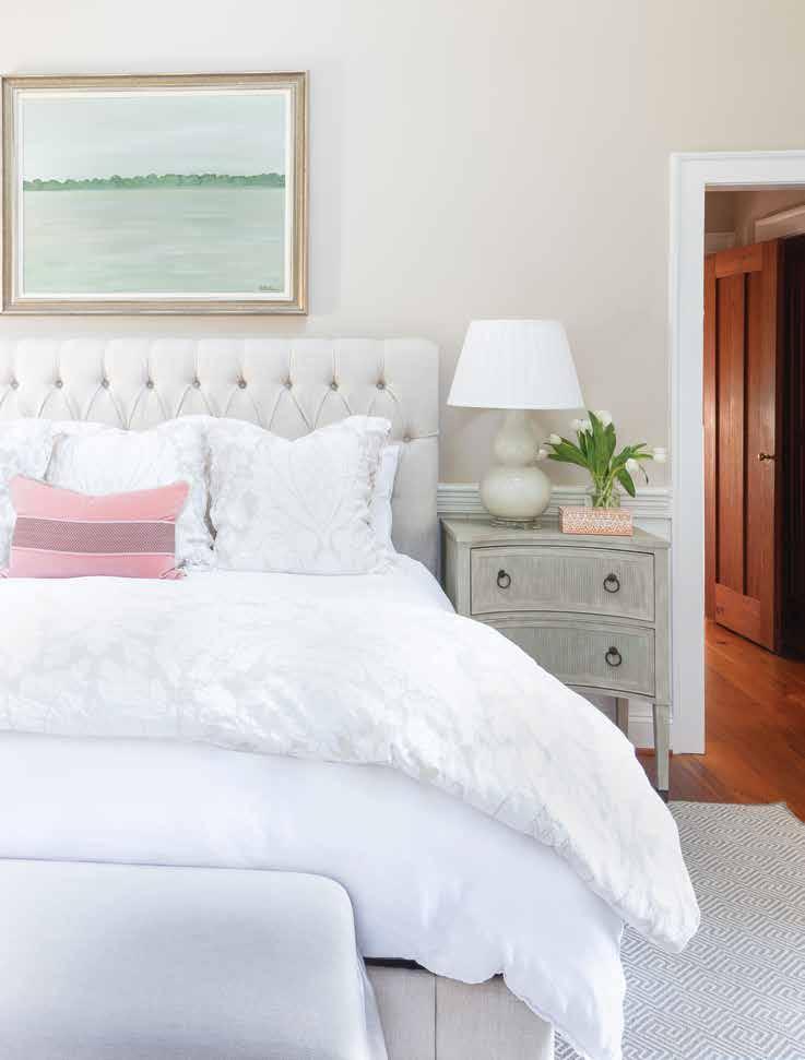 Located in the new wing of the house, the master bedroom provides tranquility with its neutral color scheme and skylights.