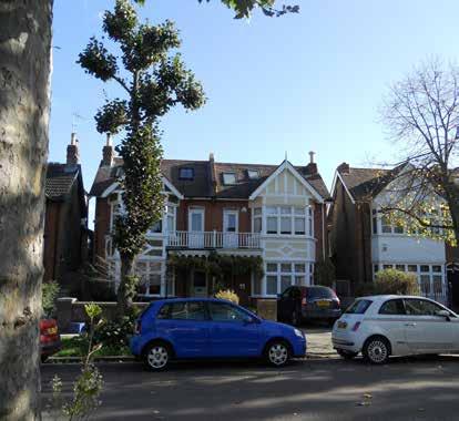 mature trees on the gentle slope between the busy Upper Richmond Road and Vicarage Road Architectural mix of Edwardian styles from Tudor Gothic with projecting half-timbered gables to