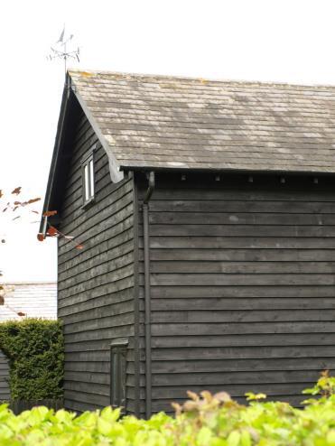 nogging. The more usual Suffolk vernacular employing a finish of lime render on laths, covering and protecting the timber framing, is mostly used, sometimes with applied patterns in pargetting.