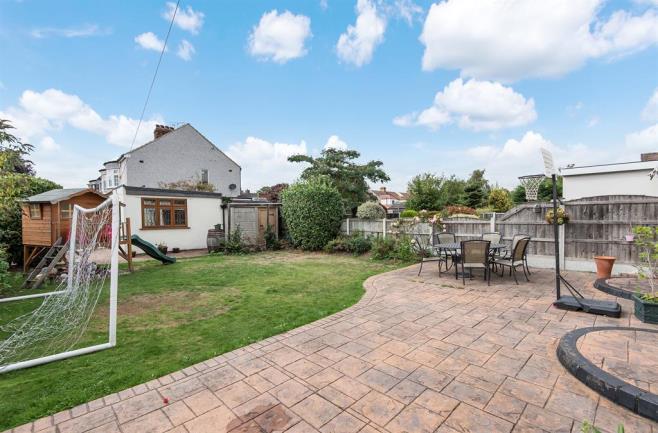 GARDEN 14.10m (46' 3") x 11.58m (38' 0") Patio area, lawn bordered by shrubs, wood panelled fencing, brick built storage shed GARAGE 6.40m (21' 0")max x 5.