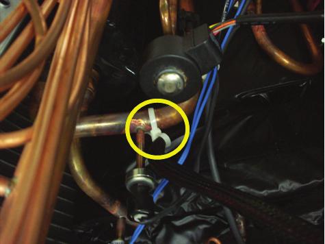 Note how the compressor harness is routed to suction tube (highlighted in yellow below). 12. Using caution and the appropriate lifting devices, remove compressor from the unit. 13.