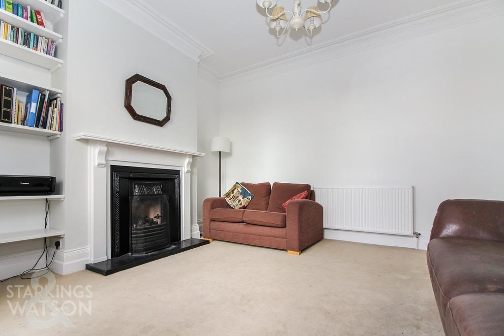 Stepping inside, the entrance hall offers HIGH CEILINGS and attractive coving and mouldings, with doors leading to the FAMILY ROOM with a feature fire place and WALK-IN BAY WINDOW, sitting room, and
