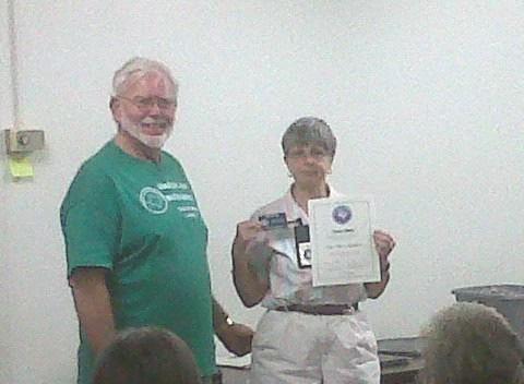 NEWLY CERTIFIED MASTER GARDENERS New Guadalupe County Master Gardeners, presented with their certificates and pins by President George Ammermann, are Treva Hicks, pictured, and J. R. Knight.