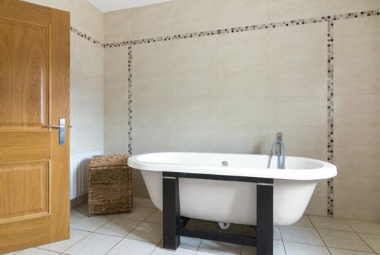 wc, wet room type shower, tiled walls and floor.