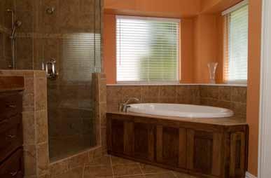 The wife wanted a new tub to relax in, as the old one was outdated and hadn t been used in years. The cabinets were also too short, and the shower was cramped and sullied with dark grout lines.