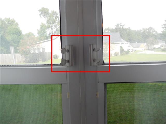 Several windows throughout the home were held shut by child-proof/security brackets.