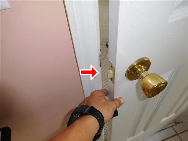 Master bathroom door needs strike and latch adjustment to shut