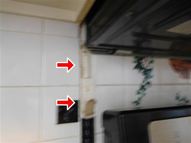 6 Item 2(Picture) (3) Decorative tile missing/damaged in kitchen above stove.